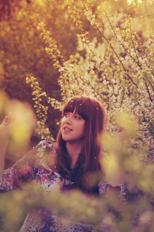 Girl near a blooming tree.