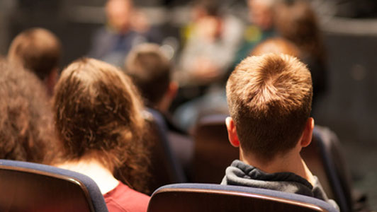 young couple as audience at play