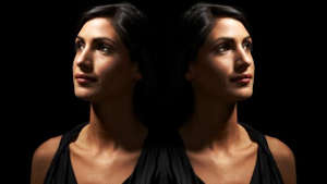 A mirrored image of a woman.