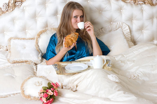 woman eating in bed