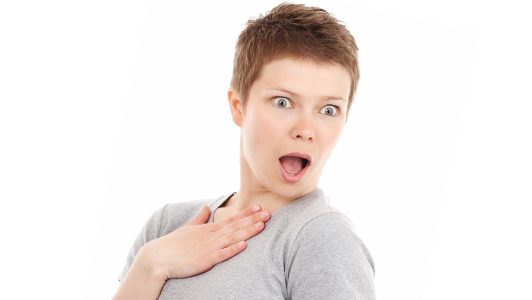 Woman with short hair looking surprised