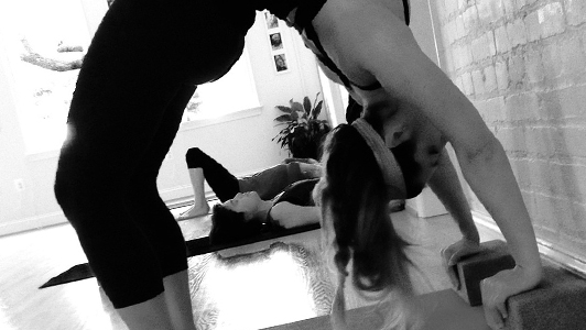 Three girls doing yoga.