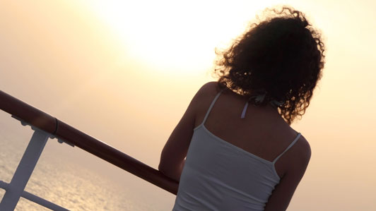 young women overlooking sunset