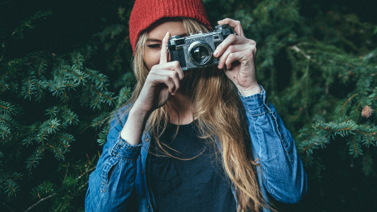 woman with red hat, looking edgy and wild