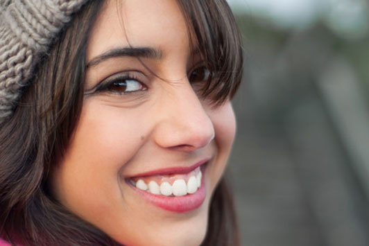 smiling girl wearing beanie