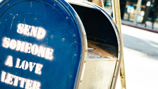 A post box witha sign saying 'send someone a love letter'