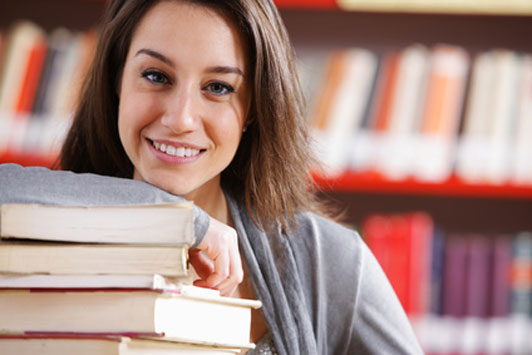 young woman reading in library