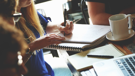 girl writing in notebook