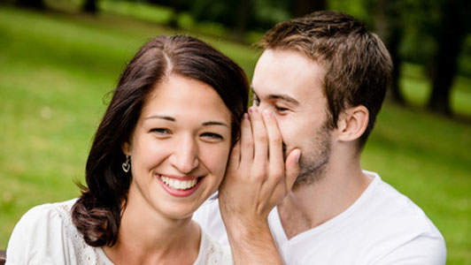 man telling woman his secrets