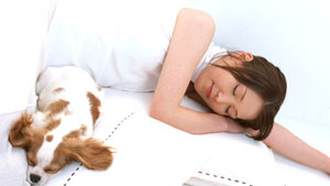 woman and dog sleeping