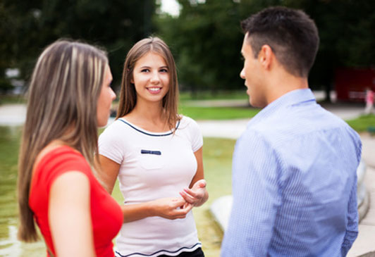 friends talking in square