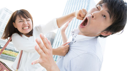 angry woman punching a man