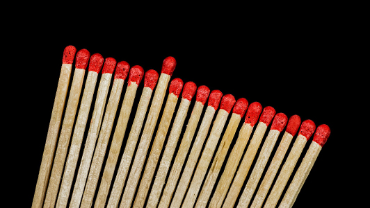 Row of matches with one sticking out.