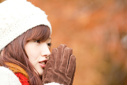 girl wearing gloves with hands together