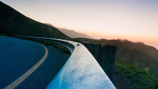 curvy road and a sunset