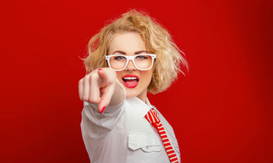 pointing woman in glasses