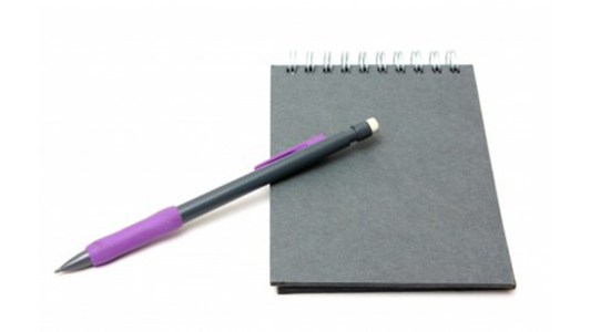 Gray notepad and a pen