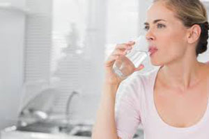 woman having a glass of water