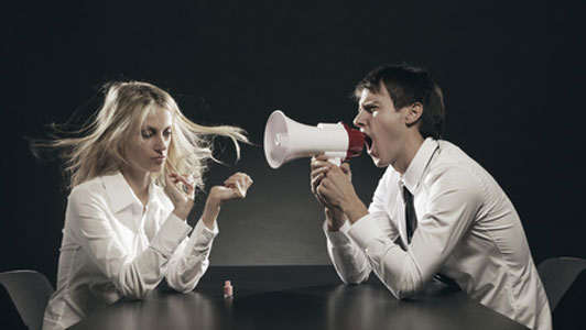 woman doing nails ignoring man screeming on microphone