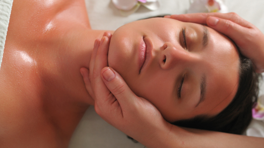 Girl getting a face massage.