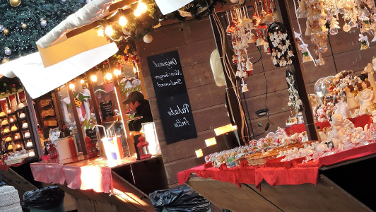 Stalls at a flea market selling Christmas ornaments.
