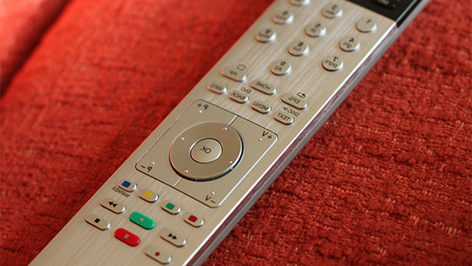 Remote control on red fabric