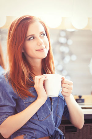 woman with white cup