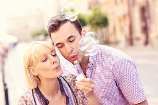 couple blowing bubbles