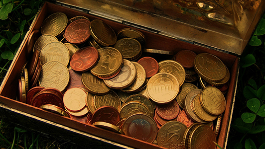 Metal box filled with coins