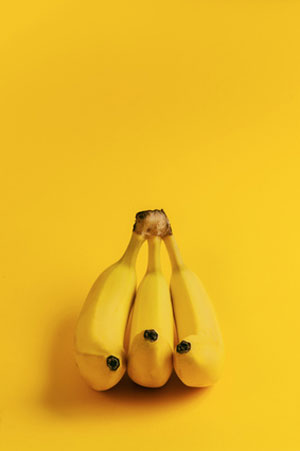 bananas on yellow background