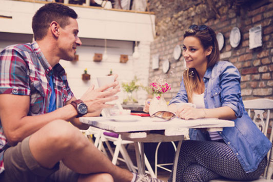 man and woman into conversation talking