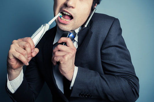 guy brushes teeth while talking